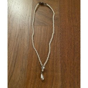 Faux pearl necklace with drop pearl and crystal heart charm